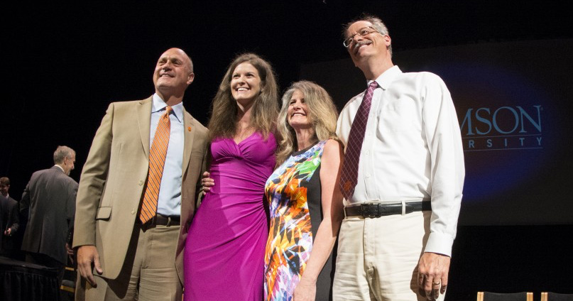 Brittany Ann Avin (in pink) poses with her parents and Clements after receiving the Norris Medal