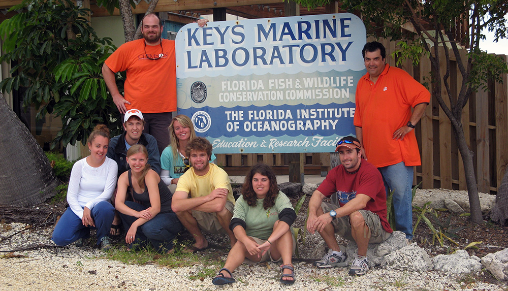 Photo of Dr. Childress and team in front of the Keys Marine Laboratory